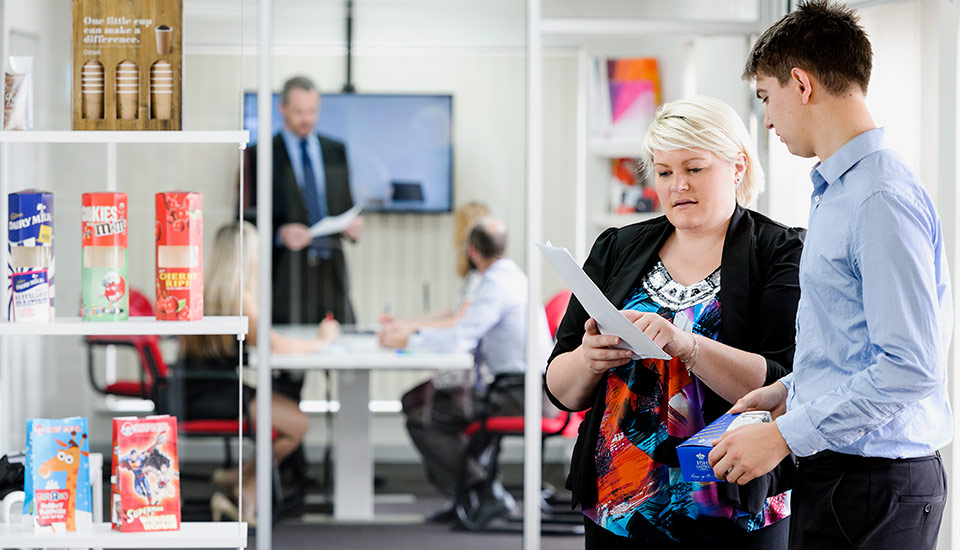 Detmold staff reviewing security report.