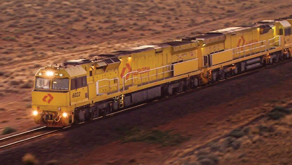 Aurizon train travelling through outback Australia.