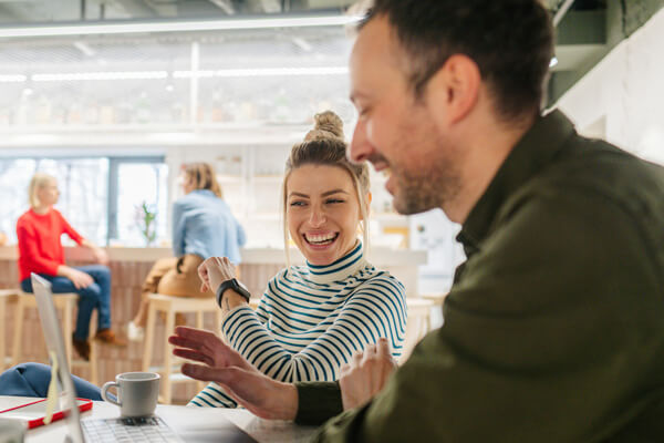 Two people casually meeting discussing a Zero Trust Plan