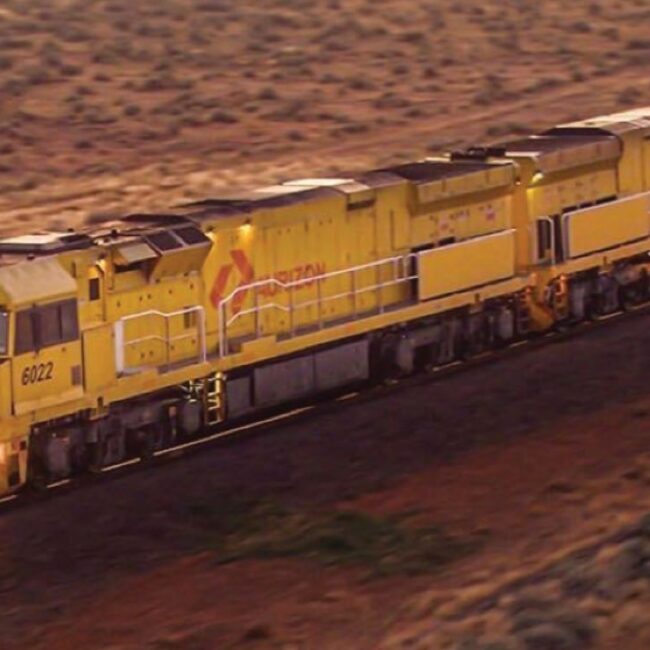 Aurizon train travelling through outback Australia.