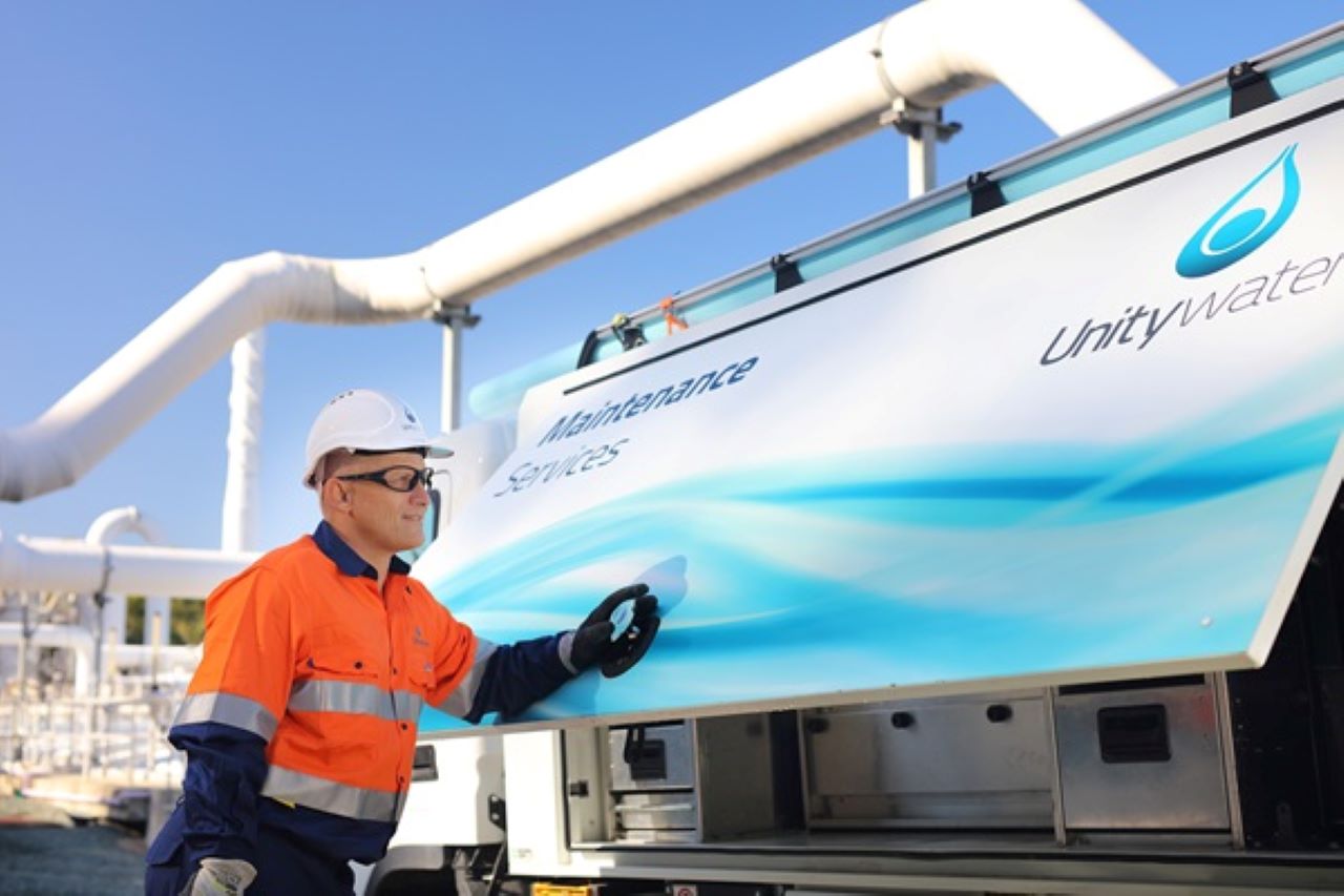 man standing in front of a Unitywater maintenance truck.