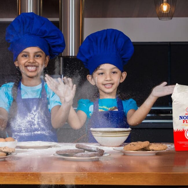 Children baking with flour