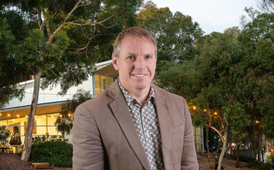 Justin Robbins in front of Civic Park building