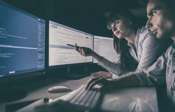 2 people on computer