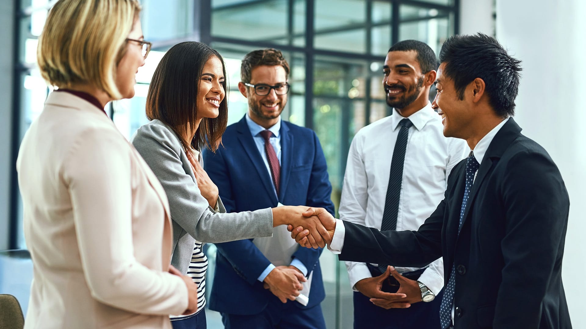 People shaking hands in a office