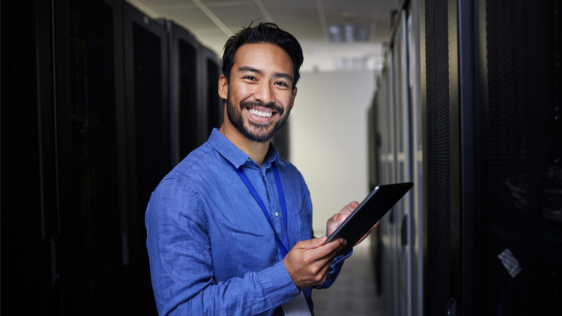 Person with tablet smiling