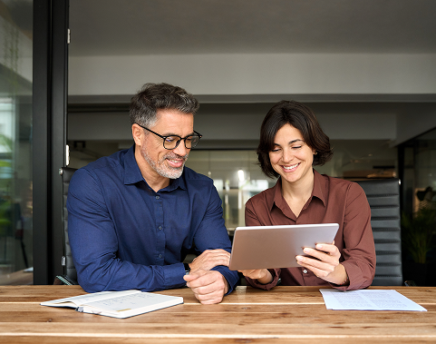 Two people looking at tablet