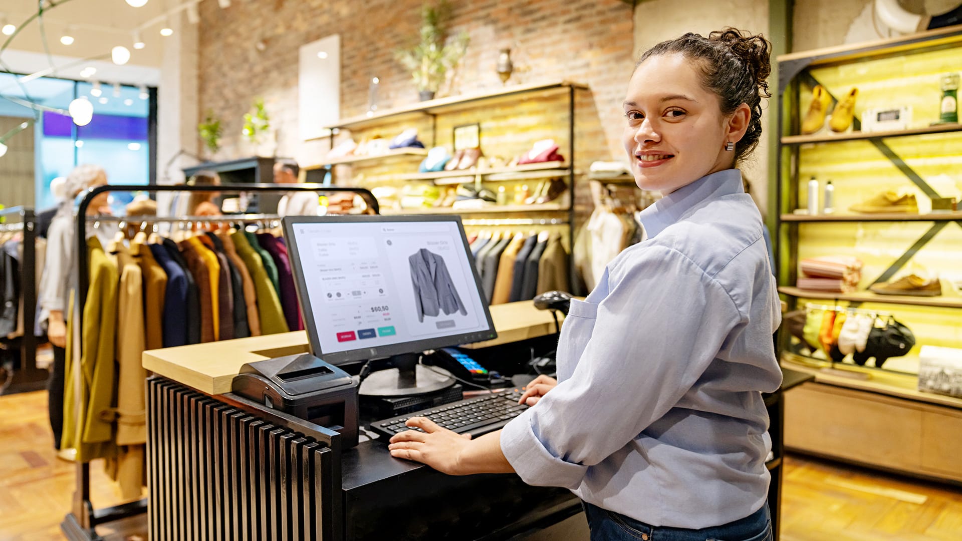 Retail store with Staff member using computer