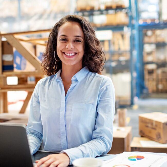 Woman in factory on computer