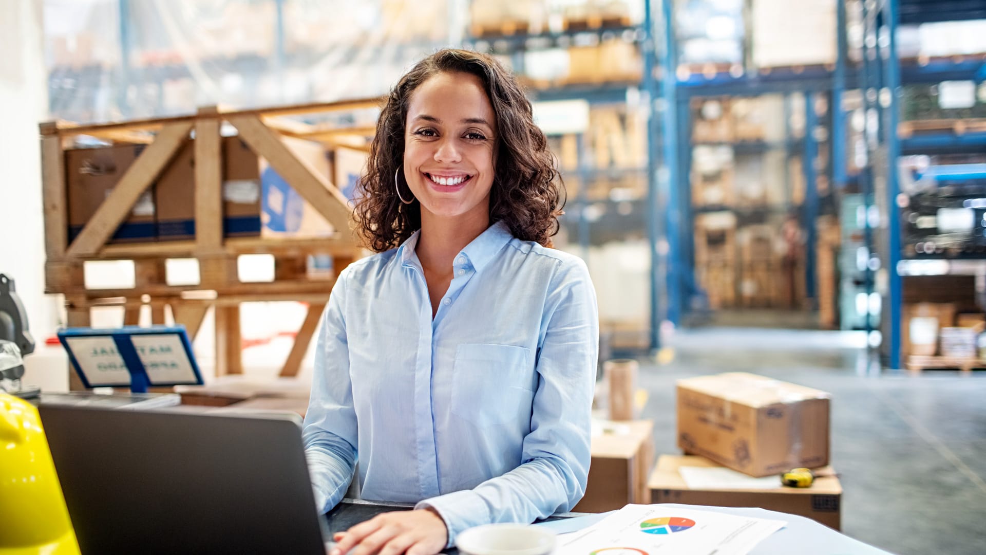 Woman in factory on computer