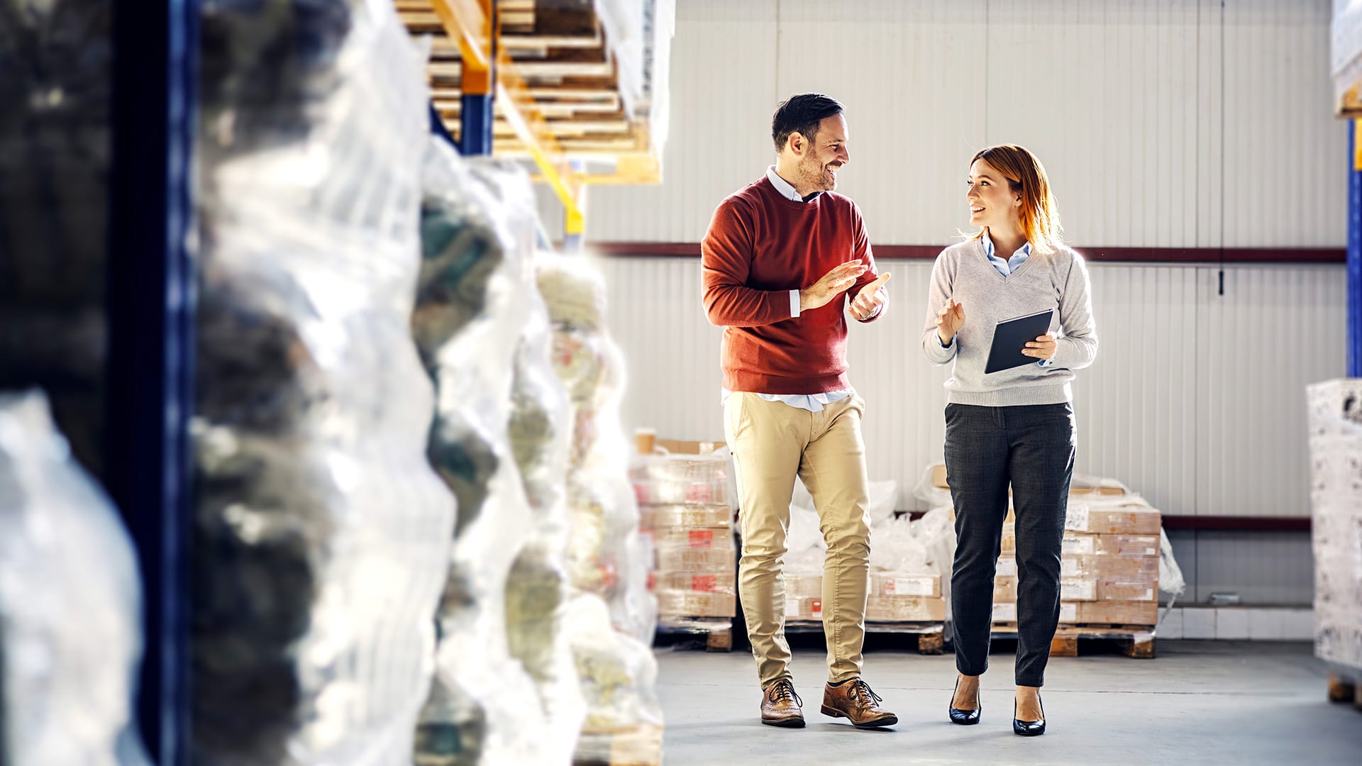 two people working on factory inventory