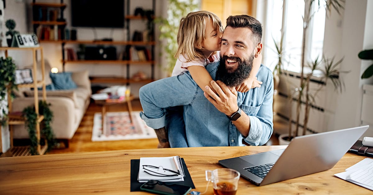 Man working from home with duaghter