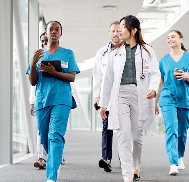Doctors discussing while walking