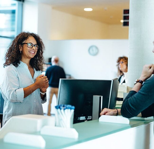 Woman at desk helping public