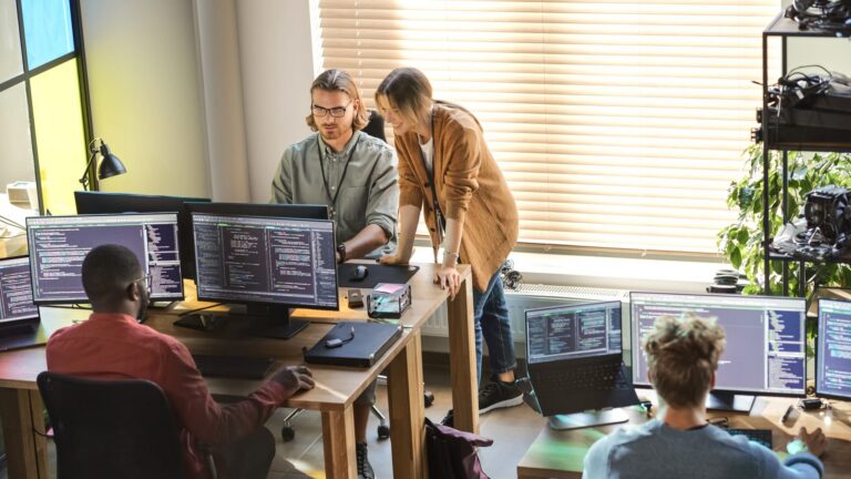 Staff working on computer in a small office