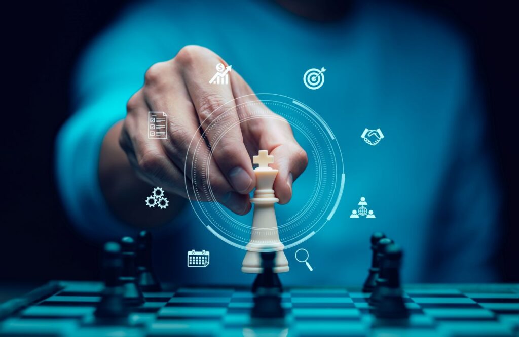 man moving chess piece strategy